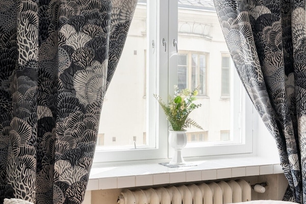 The large window lets in beautiful natural light while keeping the bustling city sounds at bay on this quiet street
