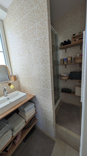 Shower, hair dryer, towels, soap