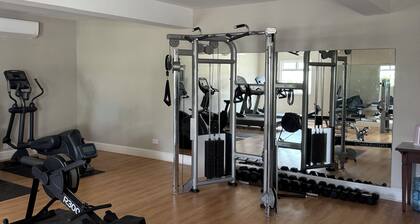 Cozy 2-bedroom apartment in charming Beach with AC and gym access