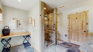 Shower, hair dryer, towels, shampoo