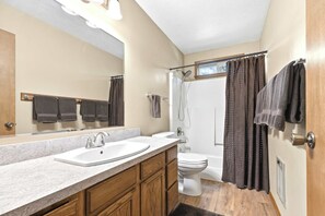 Shower, hair dryer, towels, shampoo