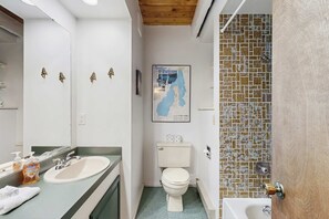 Shower, hair dryer, towels, shampoo