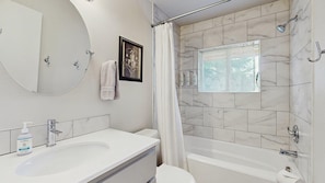 Shower, hair dryer, towels, shampoo