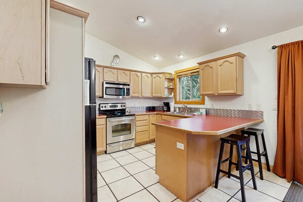 Fridge, microwave, oven, stovetop - Pet-Friendly Cabin, Fenced Yard, Near Lake (Donnelly)