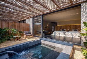 A modern spa area with a hot tub, seating, and a wooden deck. - Weizhou Island Coral Reef Hotel (Beihai)