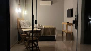 Standard Triple Room, Garden View | Laptop workspace, free WiFi