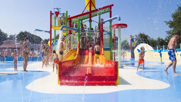 A water play area with multiple slides and water jets. - Cosy Family Chalet With Covered Terrace (Burgh-Haamstede)