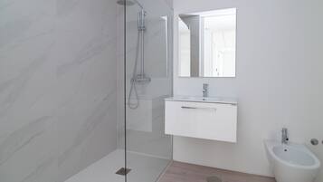 Shower, rainfall showerhead, hair dryer, towels