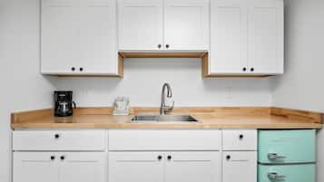 Microwave, coffee/tea maker, dining tables