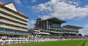 A large stadium with multiple levels of seating and a prominent advertisement for John Smith's. - Cosy Home From Home | Walk to Centre | Free Parking (York)