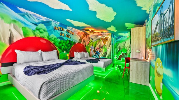 A vibrant children's room with a mural, two red beds, a desk, and a green floor. - Pokemon studio w/ Disney shuttle & pool (Kissimmee)