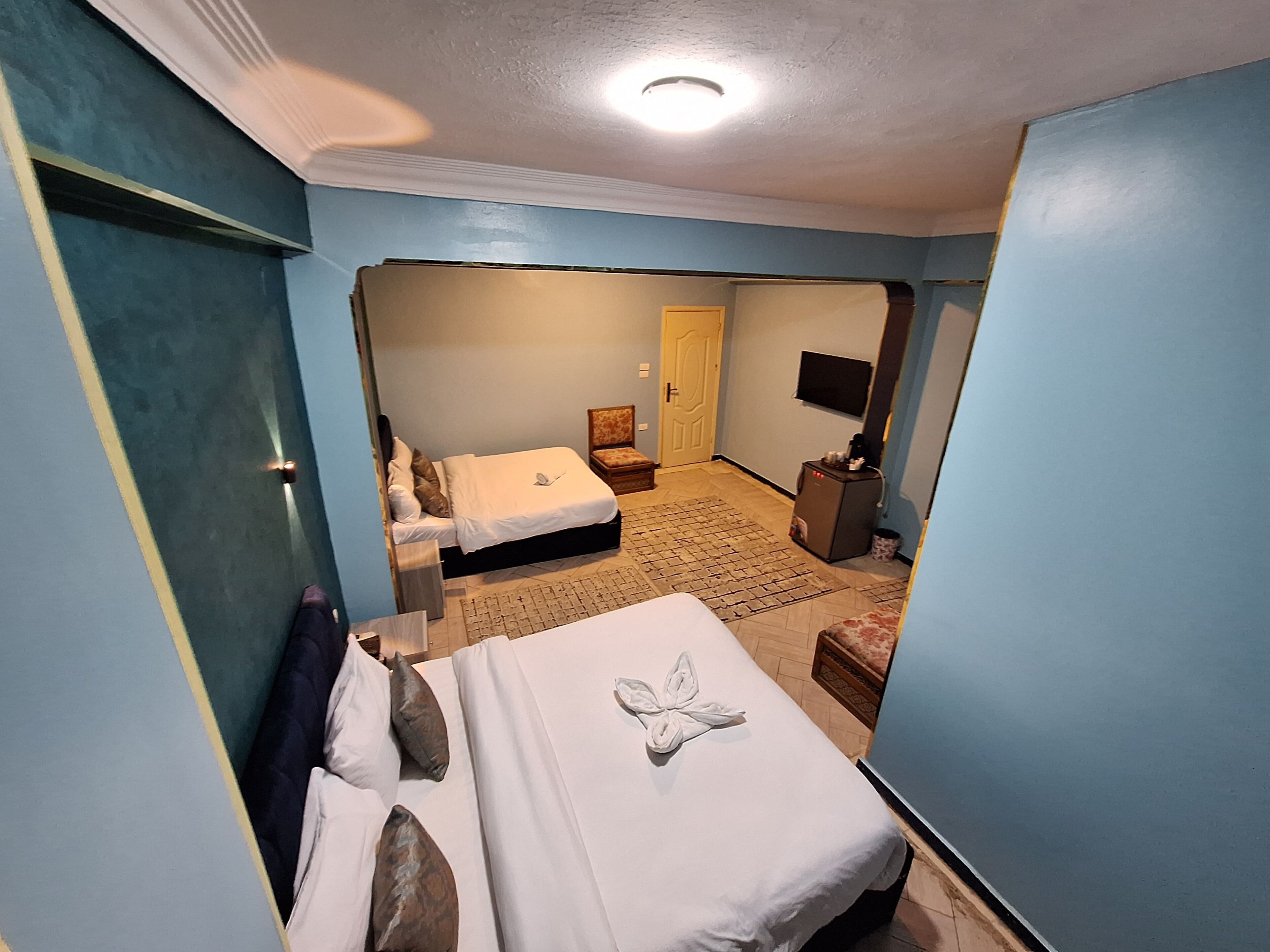 Deluxe Quadruple Room, City View | In-room safe, desk, soundproofing, iron/ironing board