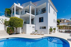 A modern two-story house with a swimming pool, multiple balconies, and outdoor seating. - Elegant Villa With sea Views & Pool Marbella (Marbella)