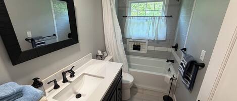 Shower, hair dryer, towels, soap