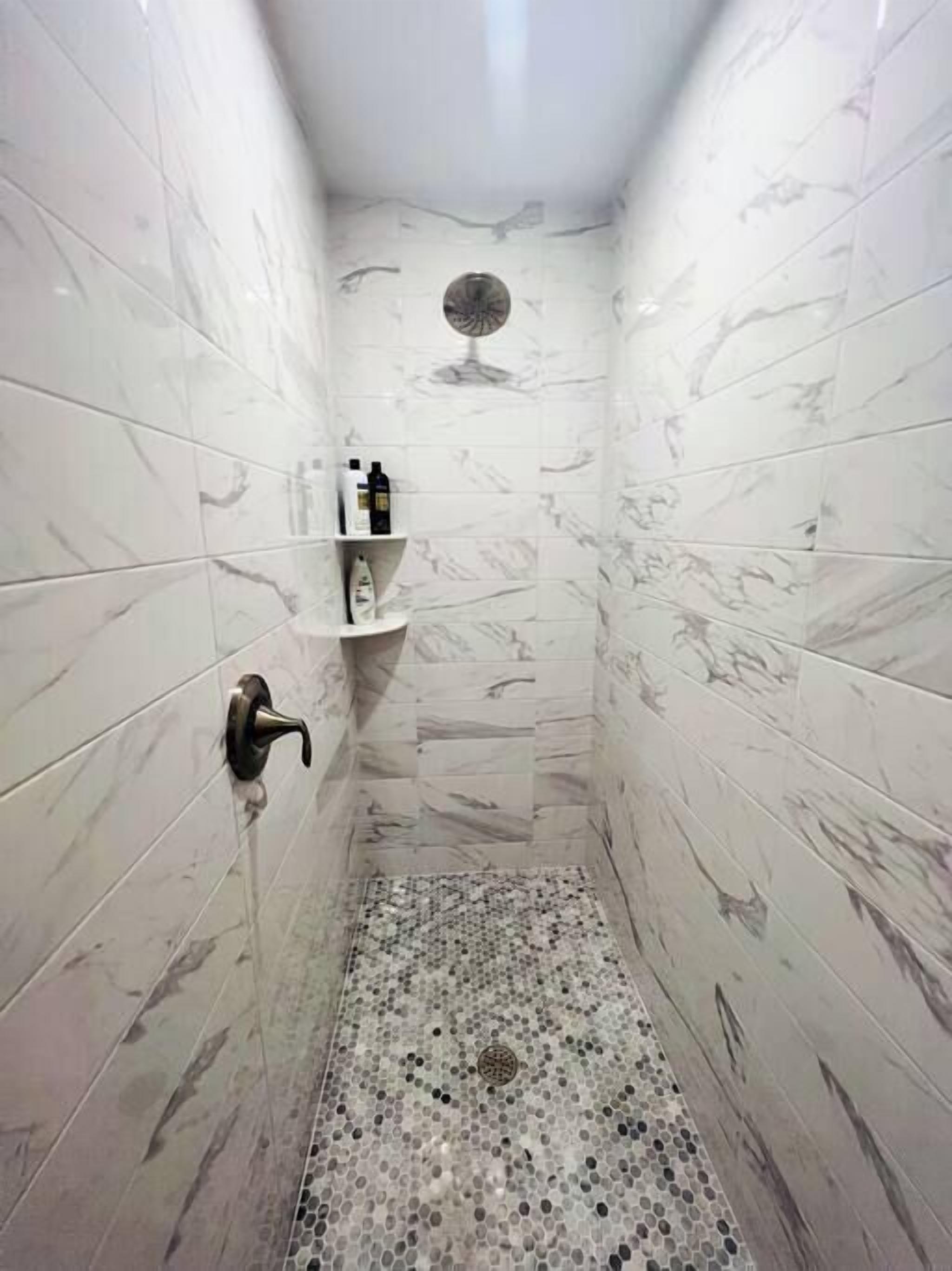 Shower, hair dryer, towels, shampoo