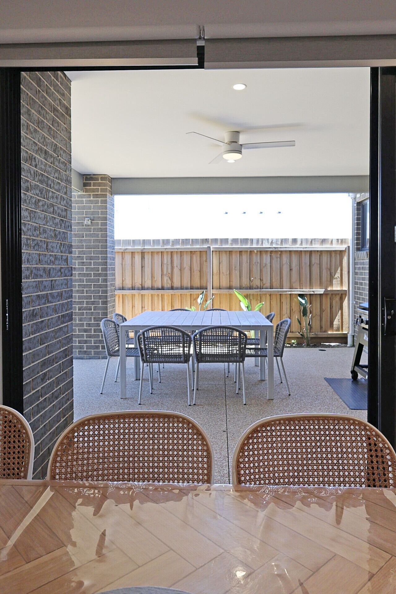 Covered outdoor dining area with BBQ—perfect for alfresco meals