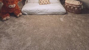 A small, triangular attic bedroom with a single bed, a stuffed toy, and a wicker basket. - Gangsters Paradise @ Renegade Hideaways (Niles)