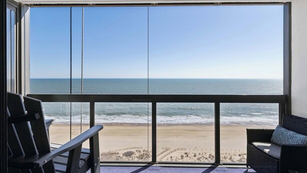 A balcony with a view of the beach and ocean. - Golden Sands 1407 (Ocean City)