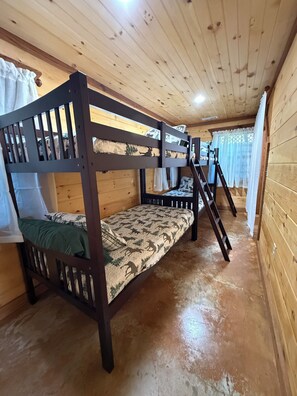 A bunk bed room with a ladder, wooden walls, and a window with curtains. - Cozy and Comfortable Cabin in Spencer. Fall Creek Falls nearby
Book Now for Fall (Spencer)
