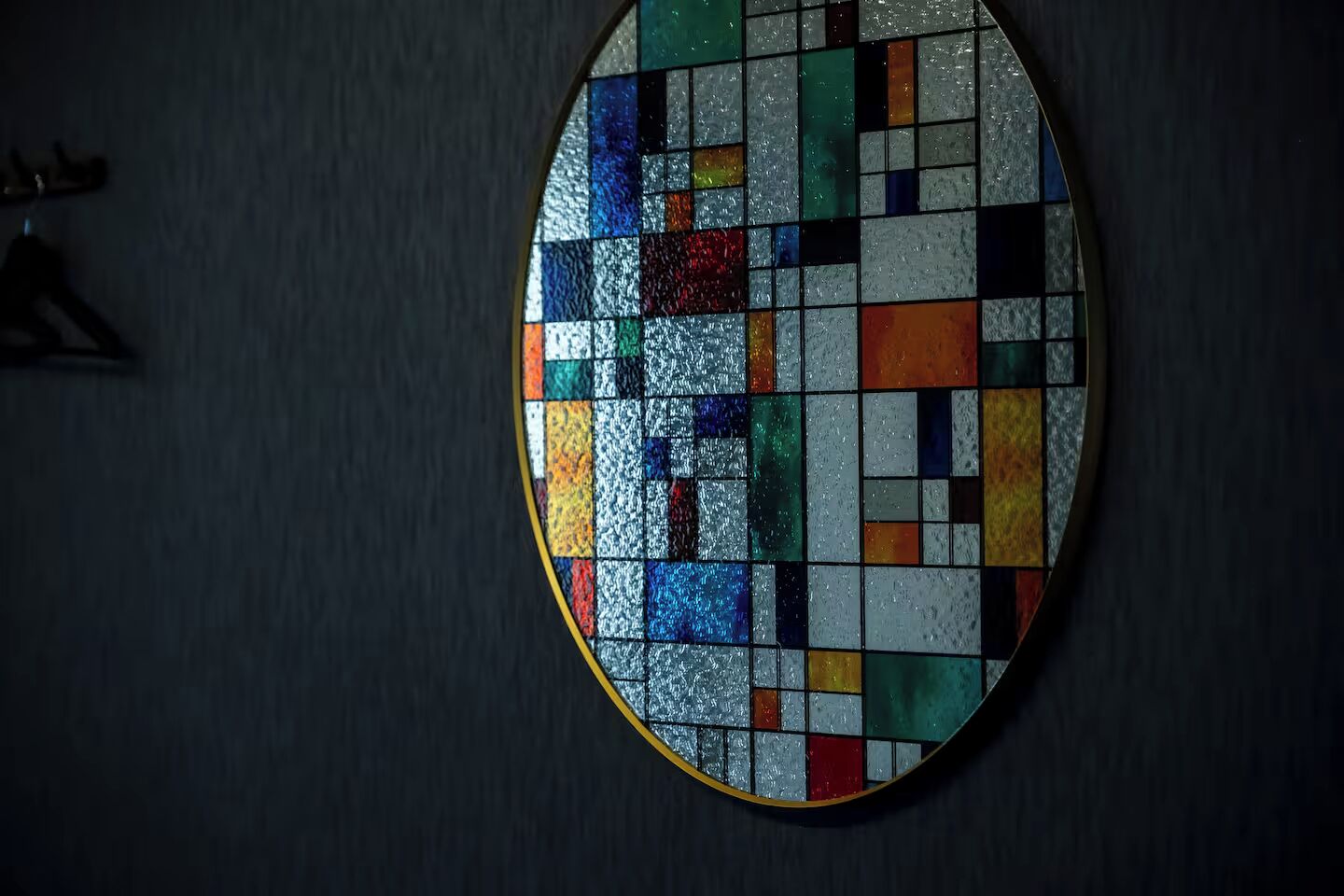 A stained glass window with a geometric pattern.