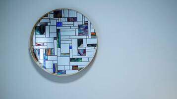 A circular stained glass window with a geometric pattern.