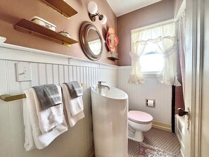 Shower, hair dryer, towels, shampoo