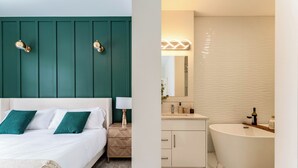 A bedroom with a bed, bedside table, and a nightstand. The bathroom features a bathtub, sink, mirror, and vanity. - Luxury 3BR Retreat Near Downtown | 5-PC King Ensuite +Private Balcony | Sleeps 6 (Calgary)