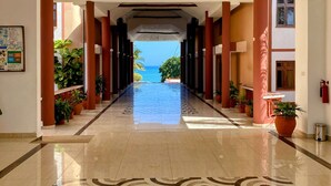 A hotel corridor with a view of the ocean. - Duplex Ocean View 1bedroom Apartment D10 ,Top Floor (Mombasa)