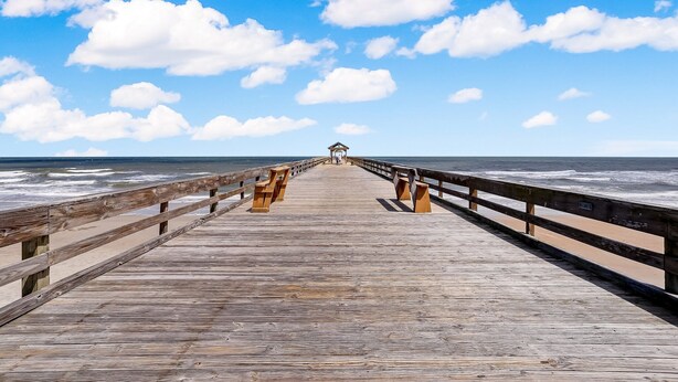 A wooden pier extending into the ocean with a gazebo at the end. - 108 Amelia by the Sea (Fernandina Beach)