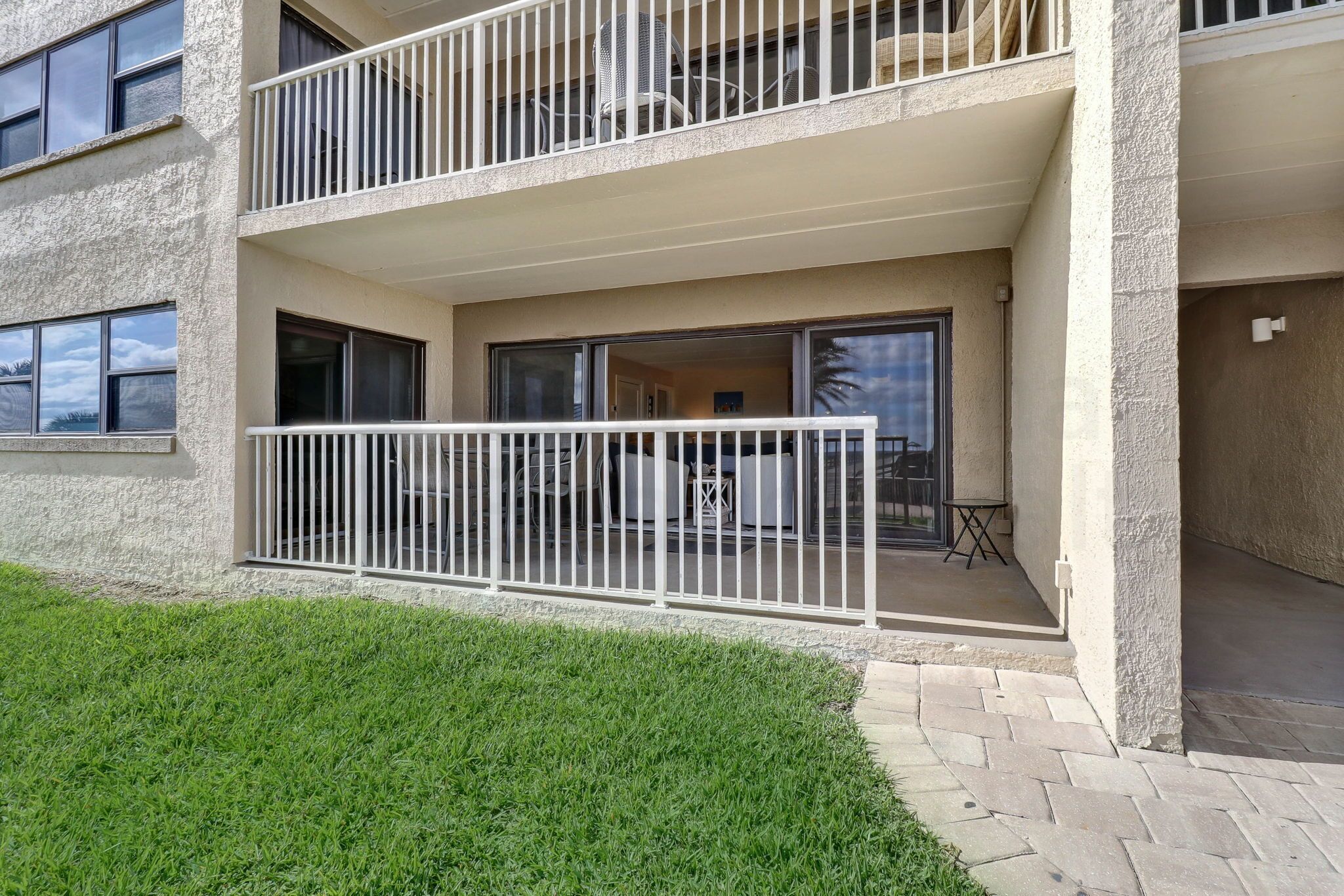 A two-story building with a balcony on the upper floor.