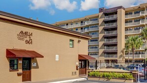 A hotel with a sign reading "AMELIA by the Sea" and a "10 minute parking only" sign. - 108 Amelia by the Sea (Fernandina Beach)