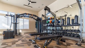 A gym with weightlifting equipment, treadmills, and kettlebells. - Gym, Pool, Washerdryer, Workerfriendly A+location (Sherman)