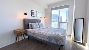 Comfort Suite, Partial Lake View | Desk, laptop workspace, blackout drapes, iron/ironing board