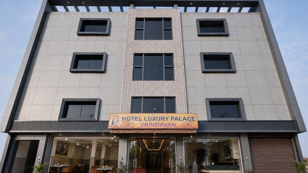 A multi-story hotel with a modern facade, large windows, and a sign for 'Hotel Luxury Palace Vridavan.' - Hotel Luxury Palace Vrindavan (Vrindavan)