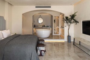 A modern bedroom with a large bed, a built-in bathtub, and a TV mounted on the wall. - Dali CloudySky Lullaby SeaviewHotel (Dali)