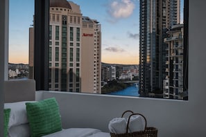 A hotel room with a view of a cityscape, including a Marriott building. - Inviting Brisbane Family 2BR | CBD | Pool & Gym (Brisbane City)