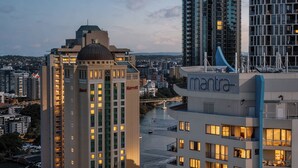 A hotel with a modern design, a prominent dome structure, and a visible Marriott logo. - Inviting Brisbane Family 2BR | CBD | Pool & Gym (Brisbane City)