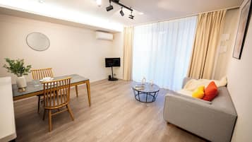 Superior Apartment, Non Smoking (208) | Living area | 32-inch LCD TV with digital channels