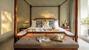 A four-poster bed with a rattan headboard, a bedside table with a lamp, and a tray with a teapot and cups. - TBK VILLA ASSAGAO ELEGANCE (Assagao)