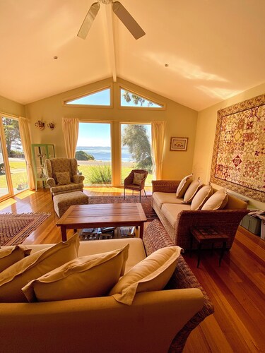 Absolute waterfront views, a cosy, country style retreat, set amongst the trees.