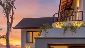 A villa with a modern design, a wooden door with carvings, and a sign that reads 'Villa Sunbeam Oasis.' - Sunbeam Oasis (Munggu)