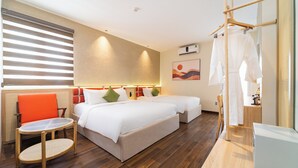 A hotel room with a large bed, a small table, a chair, and a wardrobe. - Nicecy Hotel - Bui Vien Central (Ho Chi Minh City)