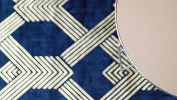 A close-up of a patterned fabric with a geometric design.