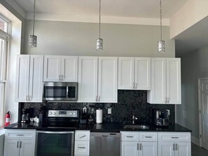 Fridge, microwave, oven, stovetop - Charmcity Residences- Unit 2 (Baltimore)