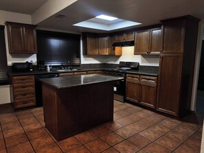 Fridge, microwave, oven, stovetop - Family-Friendly Bakersfield Home w/ Patio + Game Room (Bakersfield)
