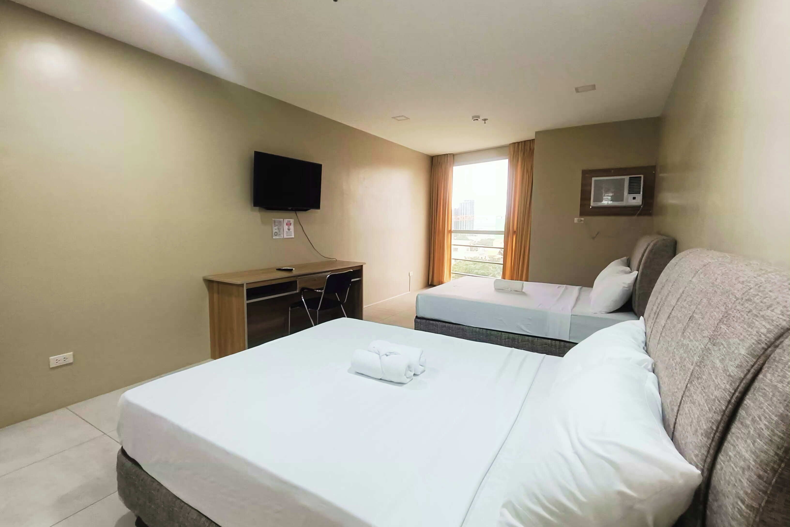 Familjerum (Suite) | Skrivbord, arbetsyta för laptop, gratis wi-fi och sängkläder