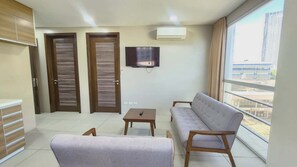 Two Bedroom Suite | Living area | 32-inch flat-screen TV with cable channels