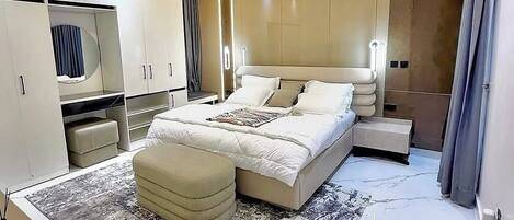 Economy Apartment, Balcony, City View | In-room safe, desk, laptop workspace, blackout drapes