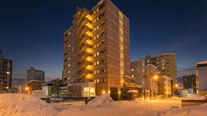 A multi-story hotel with a modern design, featuring a prominent central staircase and multiple balconies. - MP STYLE SAPPORO-50 (Sapporo)