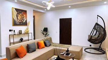 Appartement Deluxe, balcon, vue ville | Coin séjour